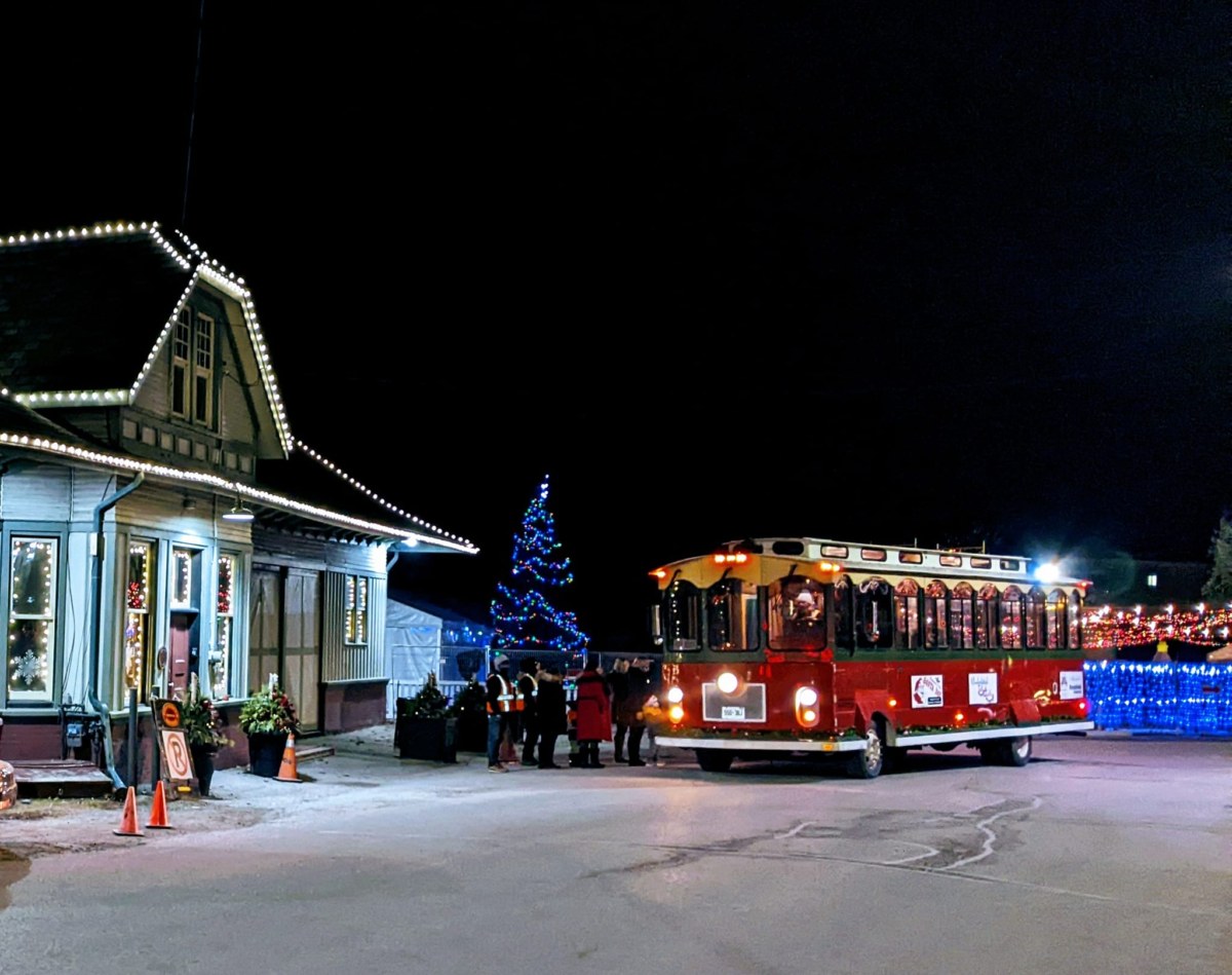 The Town Trolley picking up a group of Christmas fans to take them to the Uxbridge Optimist Fantasy of Lights